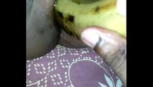 Tamil girl play with banana