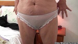 Granny with big tits wears pantyhose as she fucks a dildo